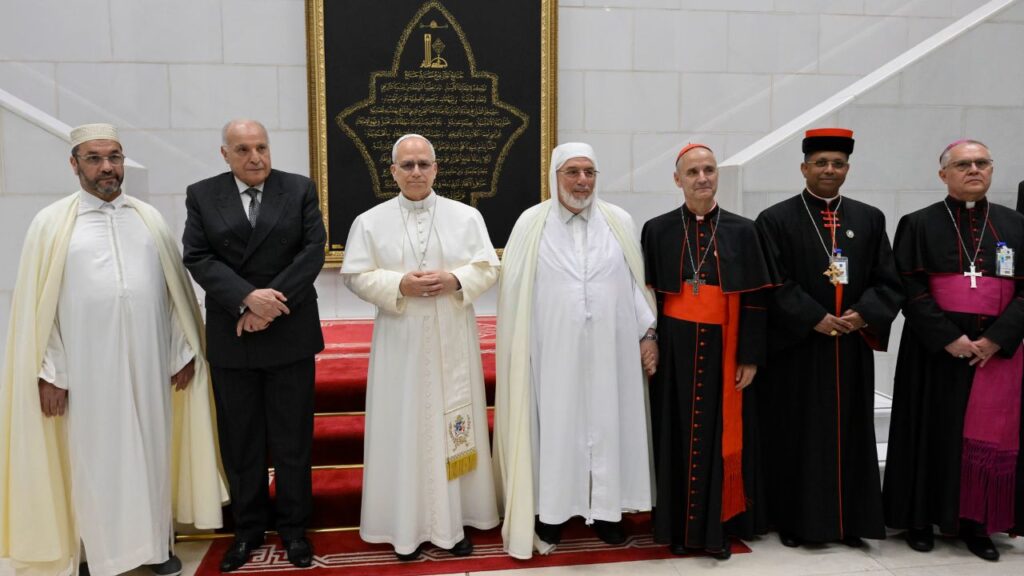 Pope Leo XIV stands with Rector Mohamed Mamoun Al Qasimi and others at the Great Mosque in Algiers, Monday, April 13, 2026. | Credit: Vatican Media