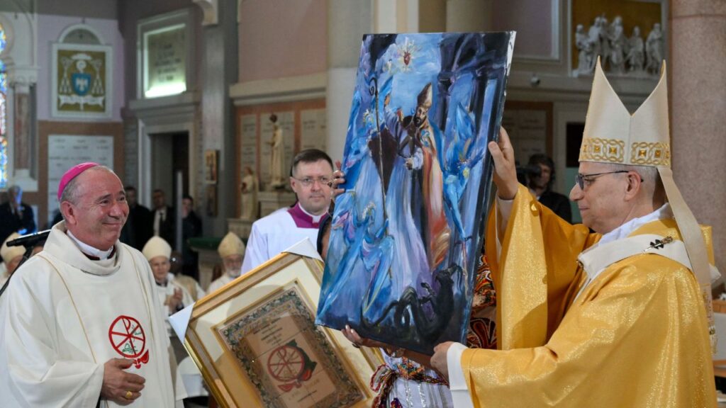Pope Leo XIV receives a painting at the Basilica of St. Augustine in Annaba, Algeria, Tuesday, April 14, 2026. | Credit: Vatican Media