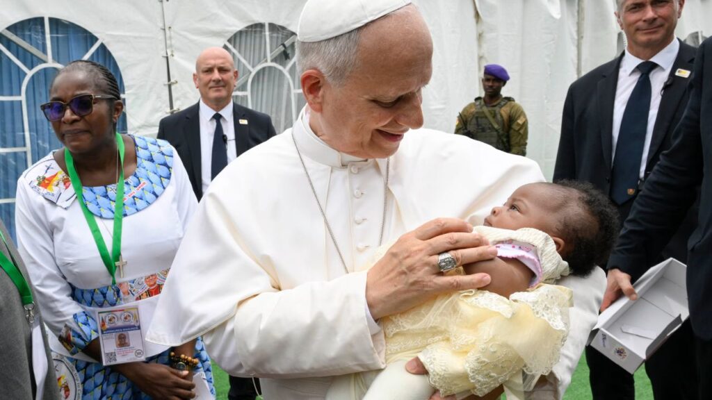 Pope Leo XIV holds a baby while at Yaoundé-Ville Airport to say Mass in Cameroon, Saturday, April 18, 2026. | Credit: Vatican Media