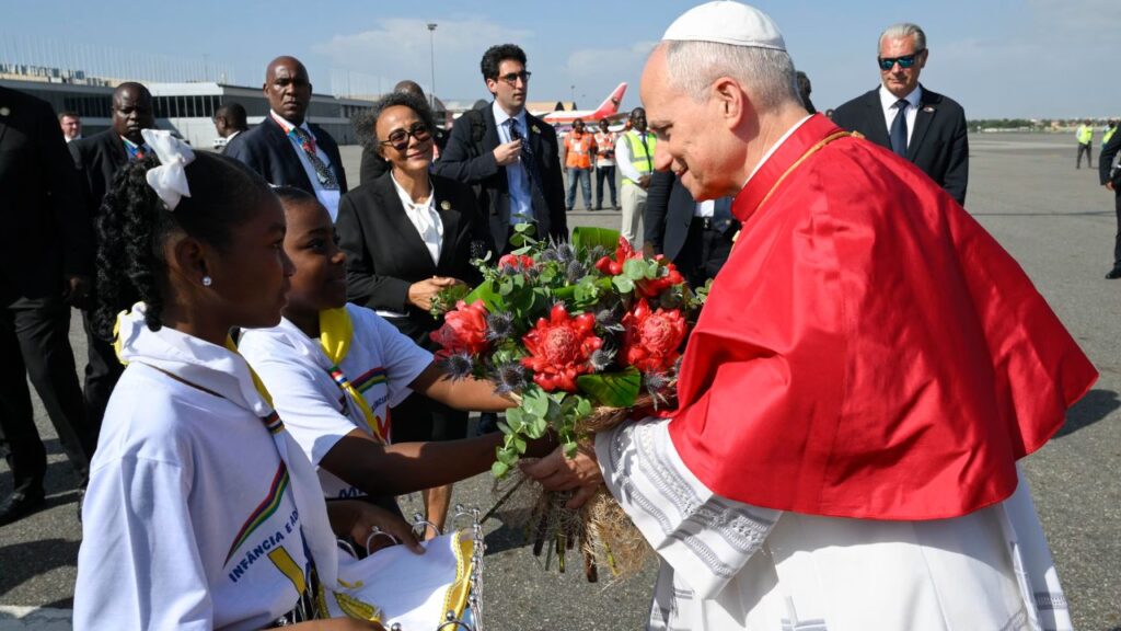 Pope Leo XIV receives flowers upon his arrival at Quatro de Fevereiro Airport in Luanda, Angola, Saturday, April 18, 2026. | Credit: Vatican Media