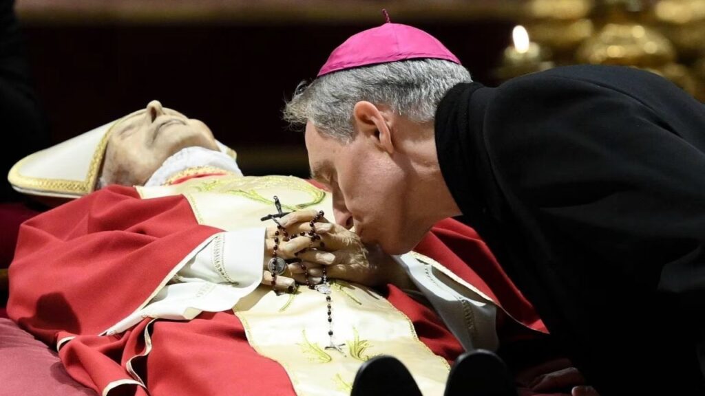 Archbishop Georg Gänswein, personal secretary to Pope Benedict XVI, bids farewell to the late pontiff while his body lays in state at St. Peter's Basilica. Vatican Media