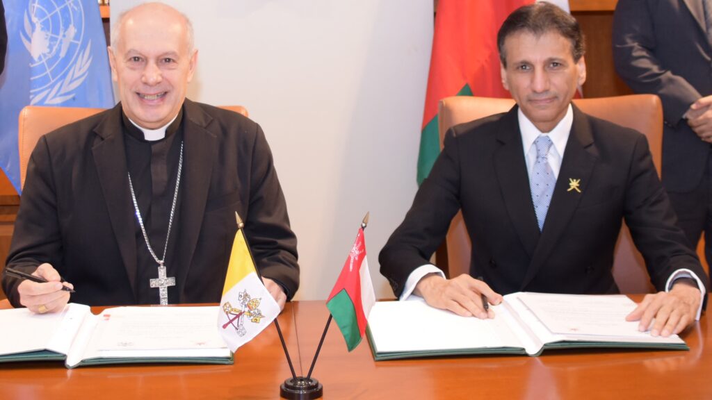 Archbishop Gabriele Caccia, Holy See Permanent Observer to the United Nations (left), and Mohammed Al-Hassan, Ambassador Extraordinary and Plenipotentiary of the Sultanate of Oman to the United Nations, at a signing ceremony establishing diplomatic relations between Oman and the Holy See. The ceremony took place at the Permanent Mission of the Sultanate of Oman to the United Nations in New York City. | Courtesy of Holy See Mission to the United Nations