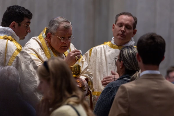 Cardinal Raymond Leo Burke distributes Holy Communion at a Pontifical Mass in the Extraordinary Form of the Roman Rite at the Papal Basilica of Saint Peter, the Vatican, Saturday, Oct. 25, 2025. Credit: Daniel Ibáñez/EWTN