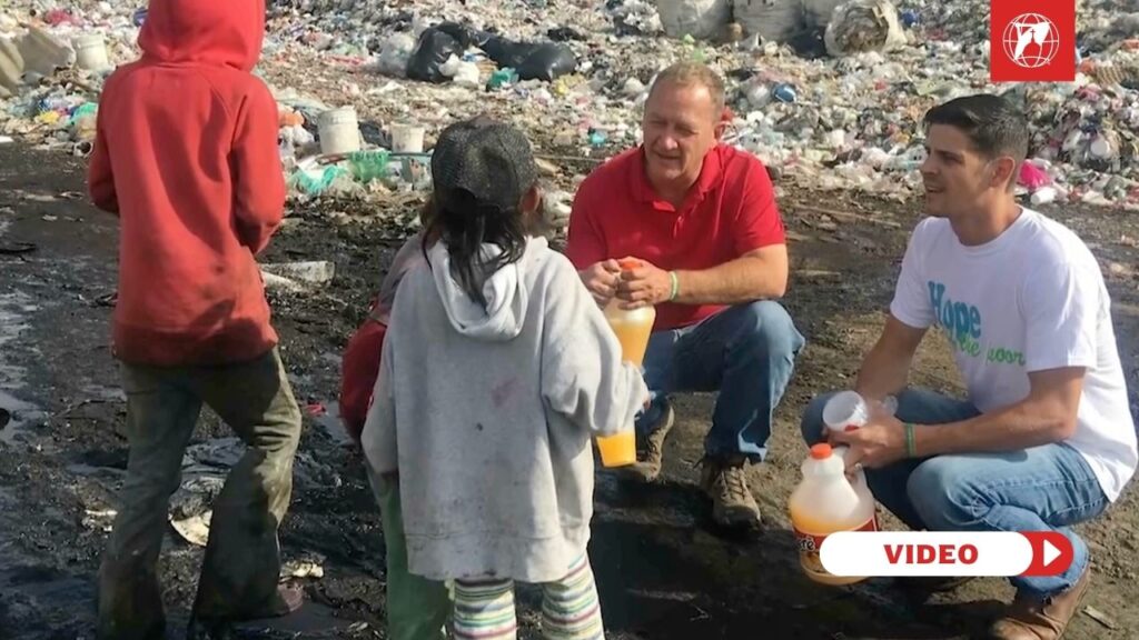 Craig Johring and Danny Leger with children in El Bordo's landfill. Credit: EWTN Vatican