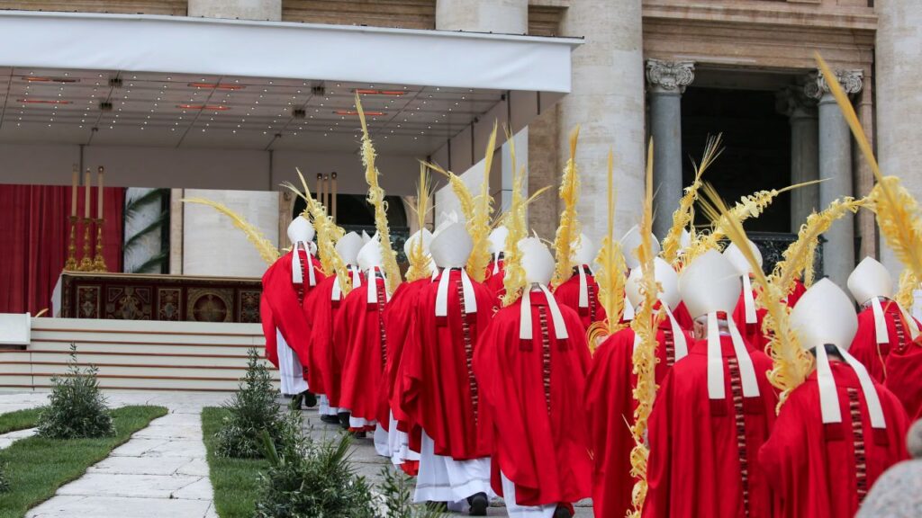 A solemn procession of cardinals and bishops carrying intricately woven palm fronds enters St. Peter’s Square during Palm Sunday celebrations in Vatican City, April 13, 2025. | Credit: Bénédicte Cedergren/EWTN