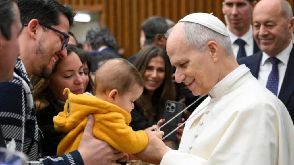 Pope Leo XIV greets a baby during a general audience at the Vatican. | Credit: Vatican Media