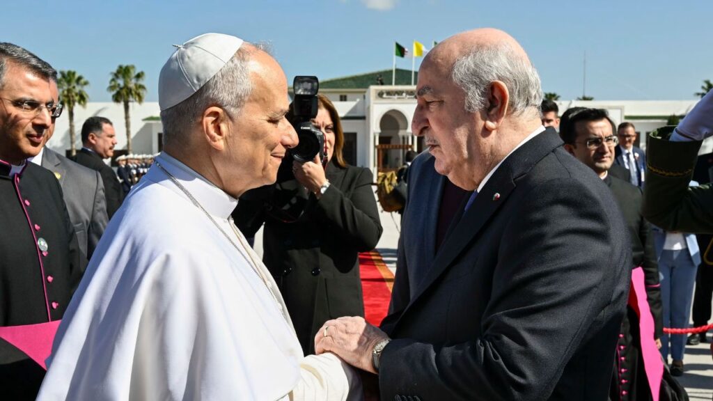 Pope Leo XIV shakes hands with Algerian President Abdelmadjid Tebboune at Houari Boumediene International Airport before departing Algeria, Wednesday, April 15, 2026. | Credit: Vatican Media