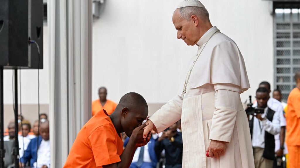 A prison inmate in Bata, Equatorial Guinea, kisses the hand of Pope Leo XIV on April 22, 2026. | Credit: Vatican Media