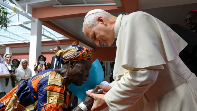 Pope Leo XIV greets an elderly woman during his visit to a nursing home in Saurimo, Angola, on April 20, 2026. | Credit: Vatican Media