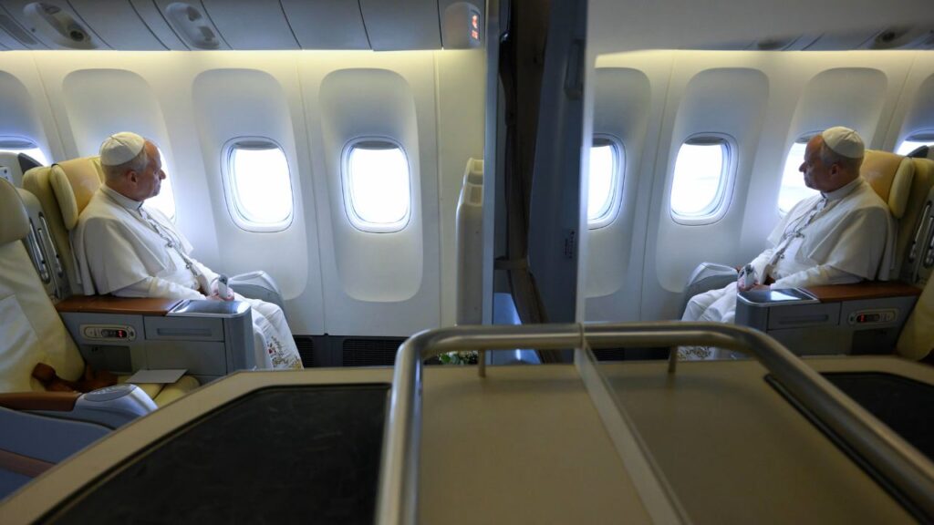 Pope Leo XIV looks out the window of the papal plane en route to Mengomeyén, Equatorial Guinea, Wednesday, April 22, 2026. | Credit: Vatican Media