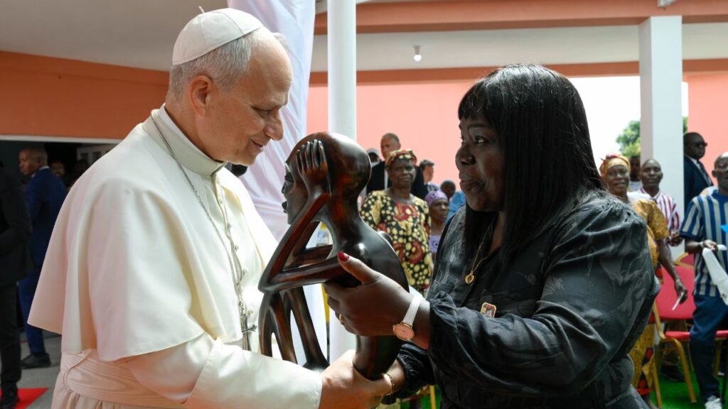 Pope Leo XIV receives a gift during his visit to a nursing home in Saurimo, Angola, on April 20, 2026. | Credit: Vatican Media