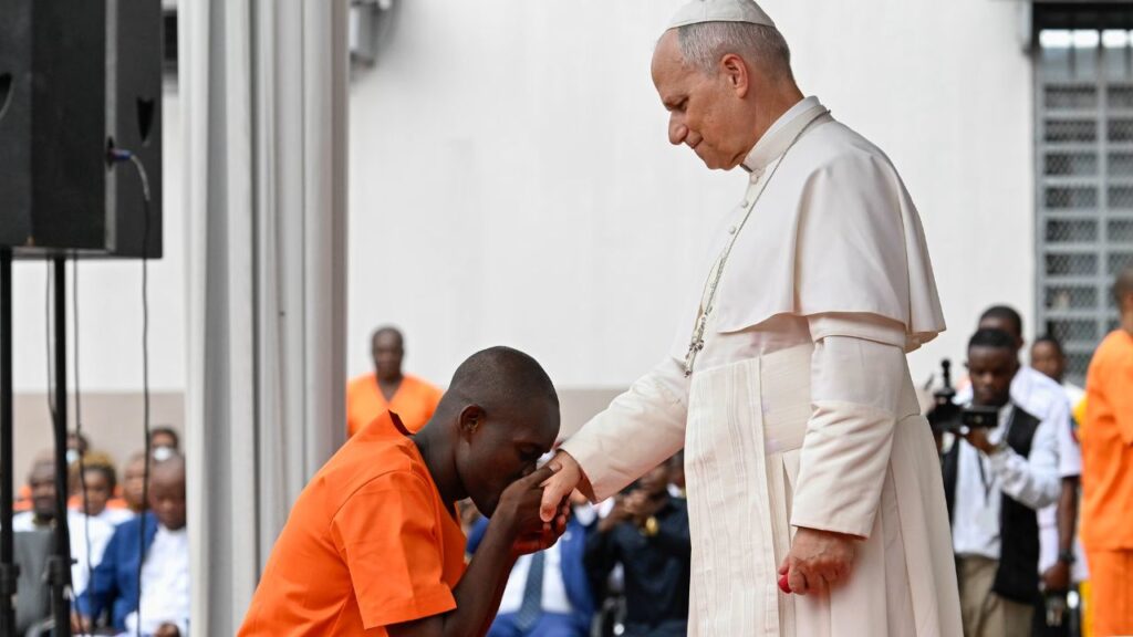 A prison inmate in Bata, Equatorial Guinea, kisses the hand of Pope Leo XIV on April 22, 2026. | Credit: Vatican Media