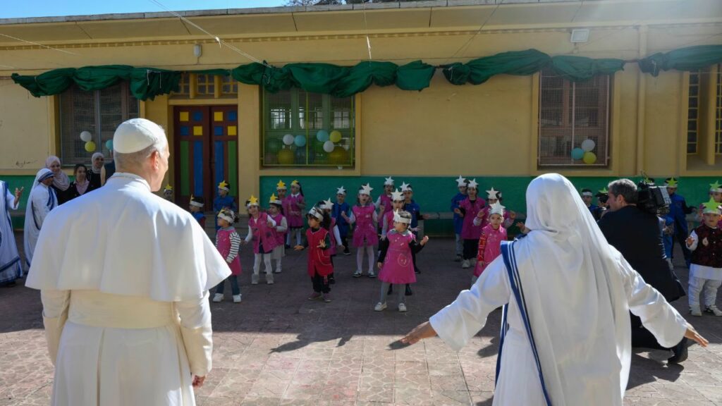 Pope Leo XIV watches a performance by children at the Notre Dame d’Afrique Kindergarten, run by the Missionary Sisters of Charity, near Algiers, Wednesday, April 15, 2026. | Credit: Vatican Media