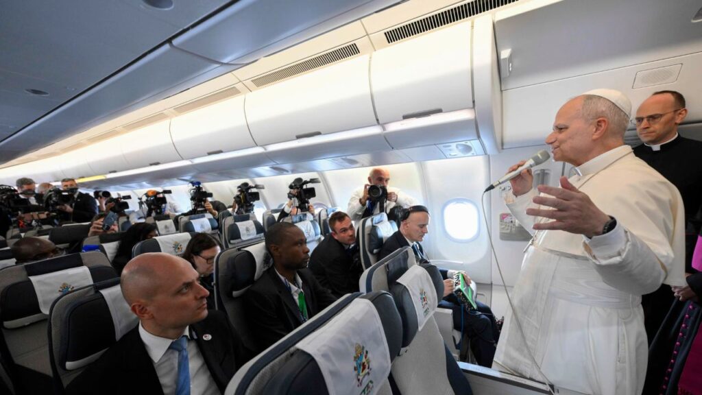 Pope Leo XIV speaks to journalists aboard the papal plane en route to Quatro de Fevereiro Airport in Luanda, Angola, Saturday, April 18, 2026. | Credit: Vatican Media