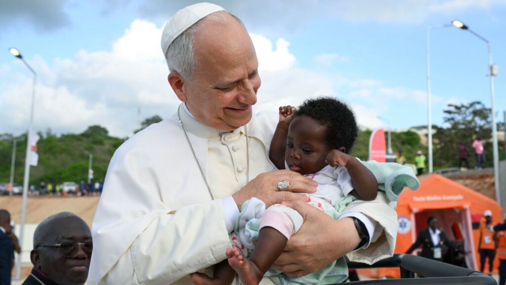 Pope Leo XIV greets a baby during his visit to the Marian shrine of Mama Muxima in Kimbaxe, Angola, on April 19, 2026. | Credit: Vatican Media