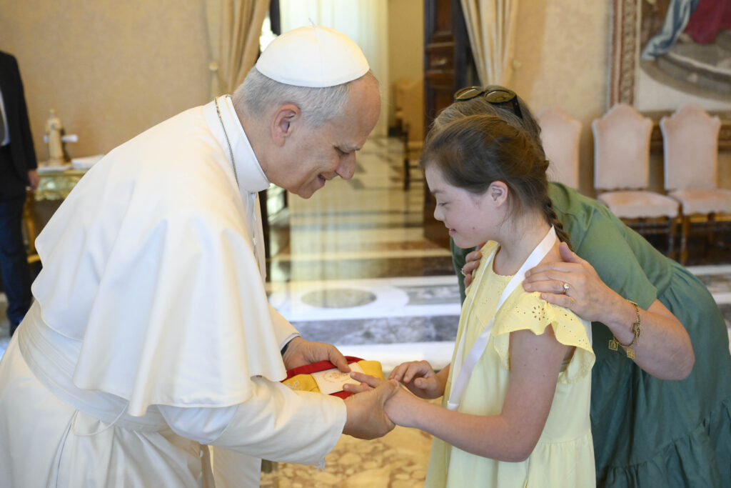 Pope Leo XIV meets a girl during his audience with members of the Jérôme Lejeune Foundation in the Apostolic Palace at the Vatican on June 22, 2026. | Credit: Vatican Media