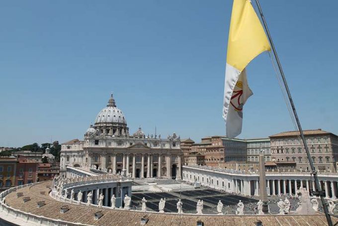 A view of St. Peter's Basilica and Vatican flag - - Bohumil Petrik