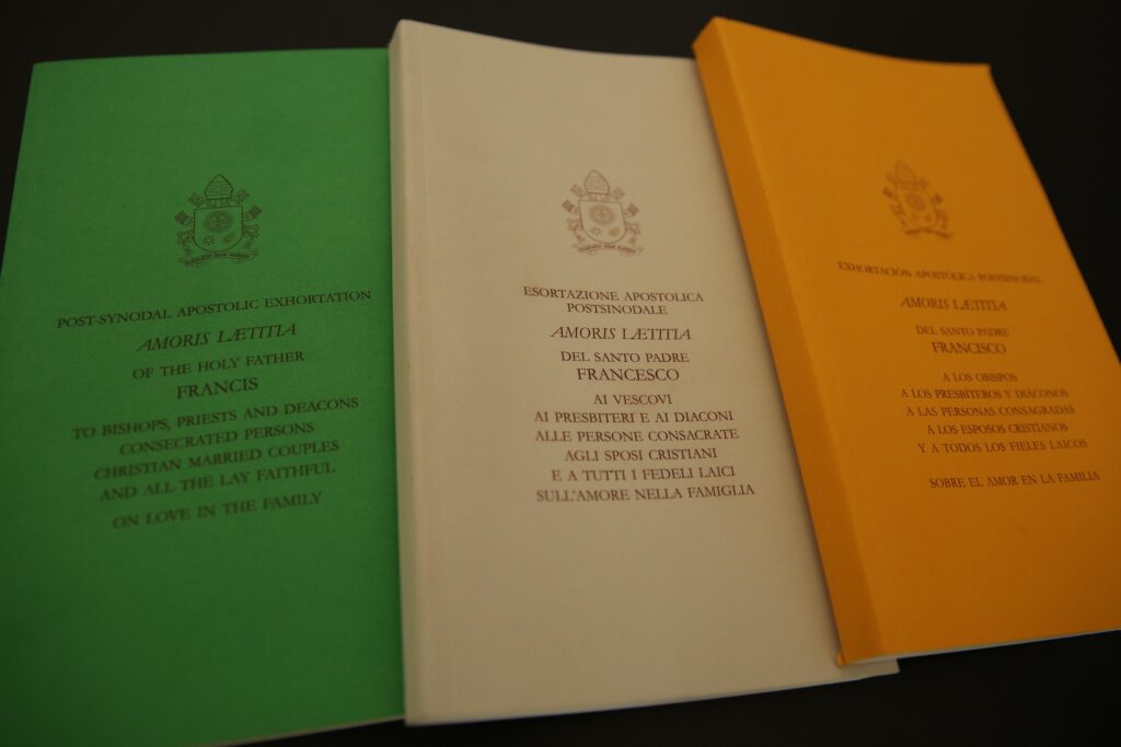 The cover of Amoris Laetitia, Pope Francis’ postsynodal apostolic exhortation on the family, in English, Italian, and Spanish. It was published and presented to the public on April 8, 2016. | Credit: Daniel Ibanez/EWTN News.