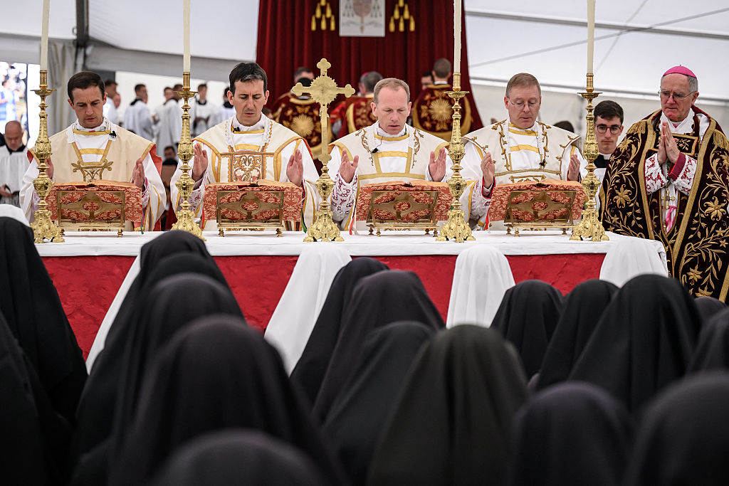 The new illicitly ordained Catholic bishops — French Marc Hanappier, French Michel Poinsinet de Sivry, American Michael Goldade and Swiss Pascal Schreiber — stand next to Swiss traditionalist Catholic bishop of the Society of St. Pius X Bernard Fellay during a schismatic consecration in Econe, western Switzerland, on July 1, 2026. | Credit: Fabrice COFFRINI/AFP via Getty Images