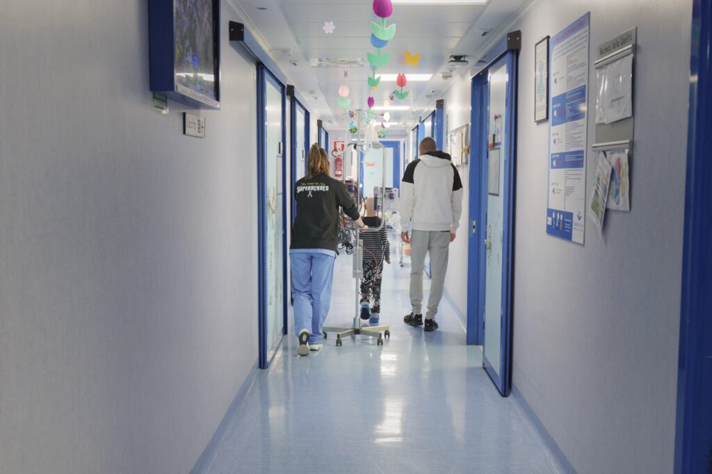 A patient in rehabilitation walks down the hall of Bambino Gesù Pediatric Hospital. | Credit: Bambino Gesù Pediatric Hospital