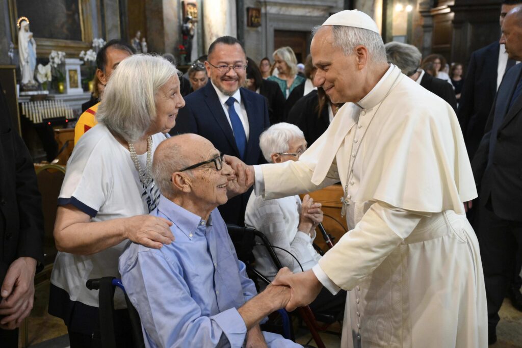 Pope Leo speaks with a couple at the Parish Church of St. Anne in the Vatican on Sept. 21, 2025. | Credit: Vatican Media