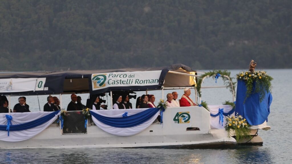 Pope Leo XIV travels across Lake Albano, Castel Gandolfo, Aug. 29, 2026. Leo took part in a Marian procession on the lake, becoming the first pope to travel by boat across the waters there according to the Vatican. | Credit: Zofia Czubak/EWTN News