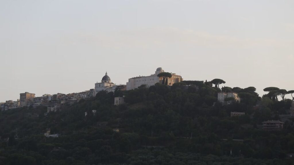 The papal palace in Castel Gandolfo is seen from Lake Albano, Aug. 29, 2026. Pope Leo XIV took part in a Marian procession on the lake, becoming the first pope to travel by boat across the waters there according to the Vatican. | Credit: Zofia Czubak/EWTN News