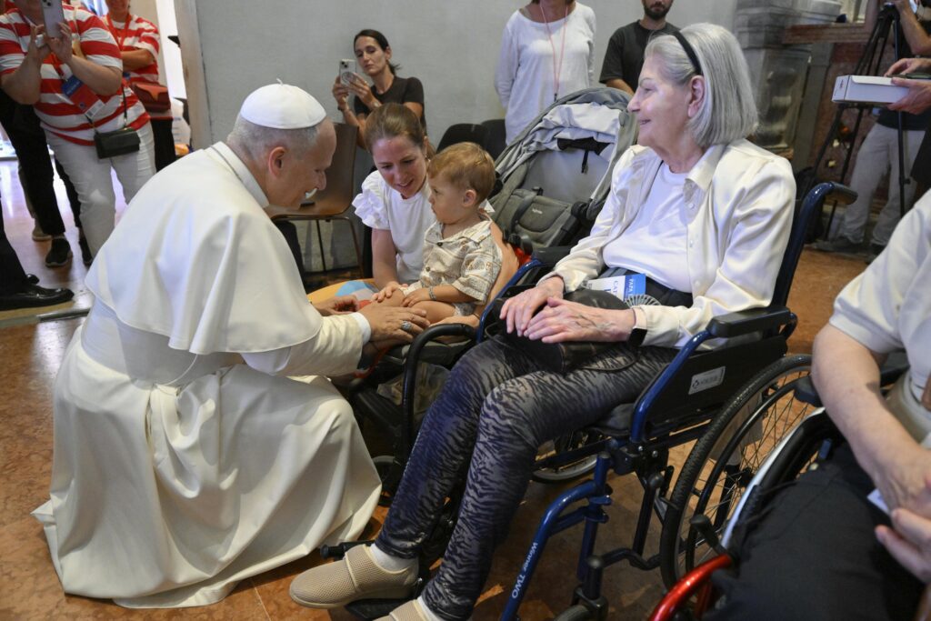 Pope Leo XIV greets a boy in a wheelchair at Rimini Cathedral, Aug. 22, 2026, during a meeting with people suffering from illnesses and disabilities. | Credit: Vatican Media
