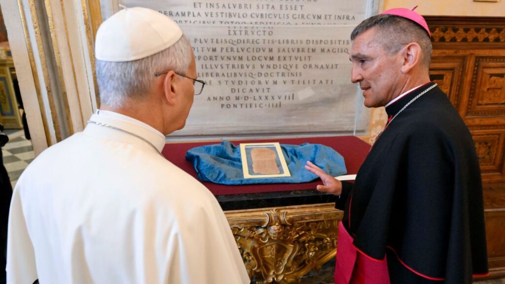 Archbishop Giovanni Cesare Pagazzi, the Holy See’s archivist and librarian, shows Pope Leo XIV one of the artifacts of the Pontifical Apostolic Library during the inauguration of the exhibit “AQVA” on Sept. 14, 2026. | Credit: Vatican Media