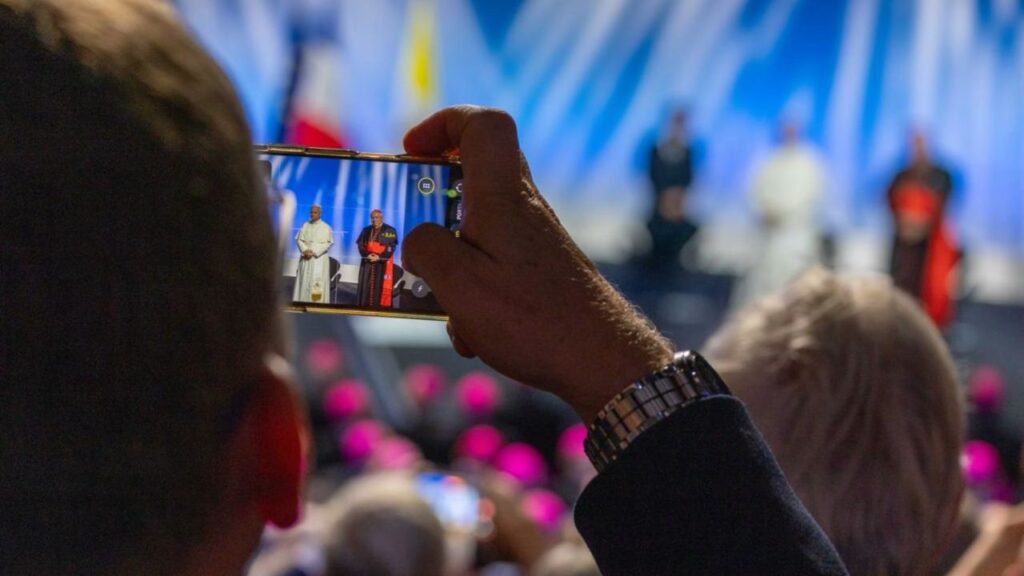 A participant takes a video recording of Pope Leo XIV’s participation at the meeting “To the Roots of Europe for Peace and Unity” at the Robert Schuman Conference Center in Metz, France, on Sept. 28, 2026. | Credit: Daniel Ibáñez/EWTN News