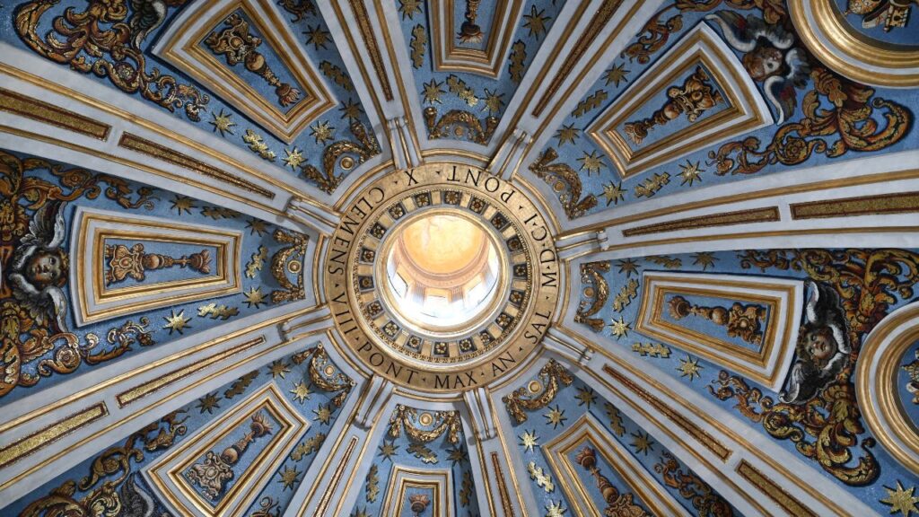 The circular hole contains the name of Pope Clement VIII, who commissioned the Clementine Chapel on the upper floor of St. Peter’s Basilica. The restoration of the dome’s mosaics was completed in September 2026. | Credit: Fabbrica di San Pietro