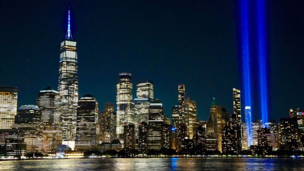 The Tribute in Light annual 9/11 memorial’s twin shafts of light soar skyward over Manhattan’s skyscrapers in 2025. | Credit: George Wirt/Shutterstock