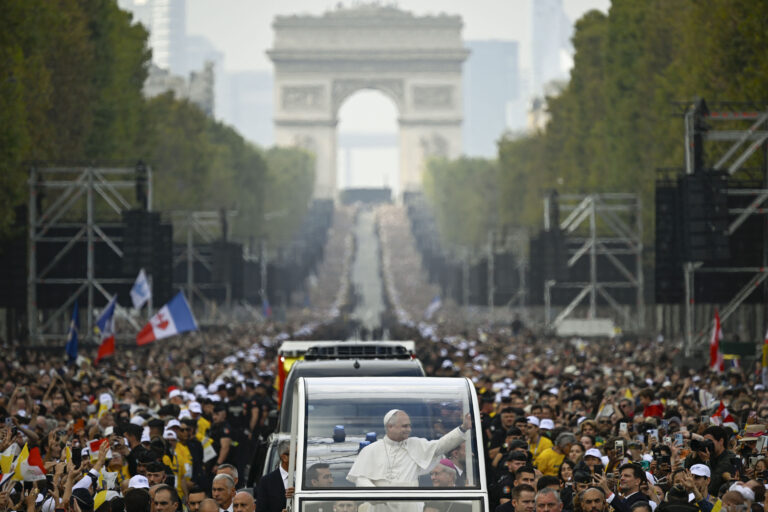 Pope Leo XIV waves to the crowds gathered for his open-air Mass on Sept. 26, 2026, in Paris. An estimated 800,000 people gathered along the route. | Credit: Vatican Media