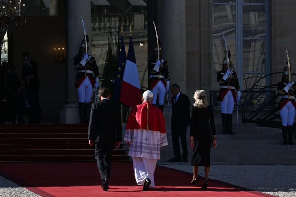 Pope Leo XIV walks with the President of France, Emmanuel Macron, and the first lady of France, Brigitte Macron, at the Élysée Palace in Paris on Sept. 25, 2026. | Credit: Alessia Giuliani/EWTN News/Vatican Pool