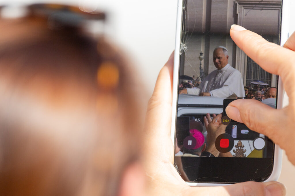 A woman records Pope Leo XIV on her cellphone during the general audience on Sept. 9, 2026, in St. Peter’s Square. | Credit: Daniel Ibanez/EWTN News